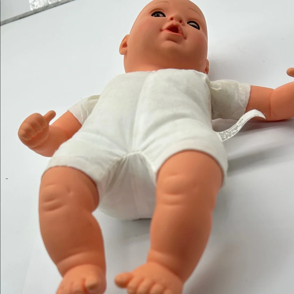 Realistic Baby Doll with White Outfit